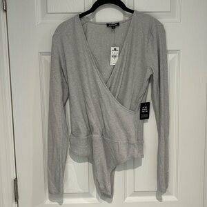 Brand new Express body suit.